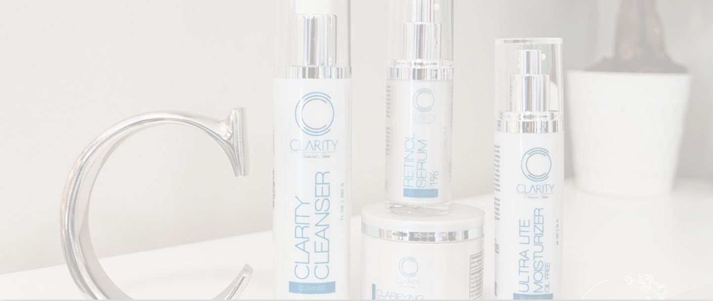 Skincare products on a white countertop.