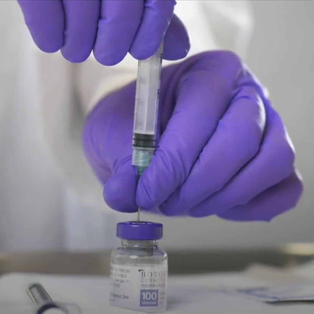 Filling syringe from a Botox vial.