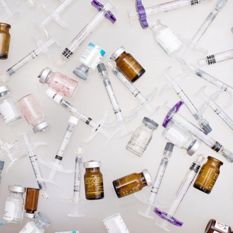 Various syringes and vials for medical use.