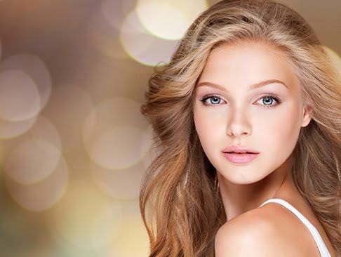 Young woman with beautiful hair and soft makeup.