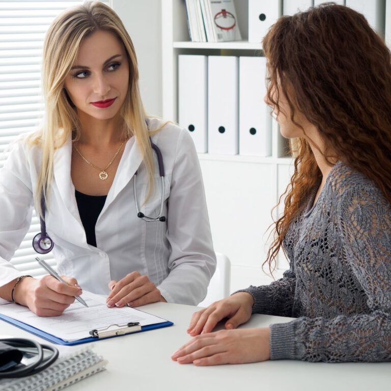 Doctor consulting with patient in medical office.