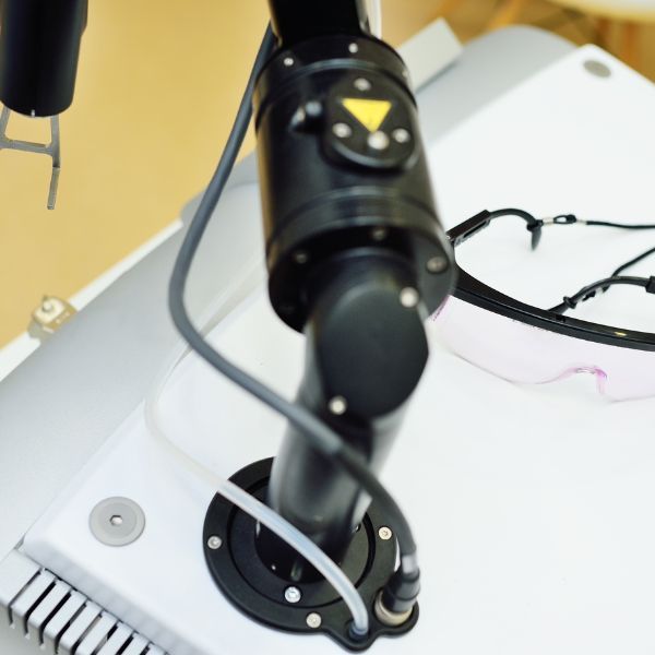 Robotic arm with safety glasses and equipment.