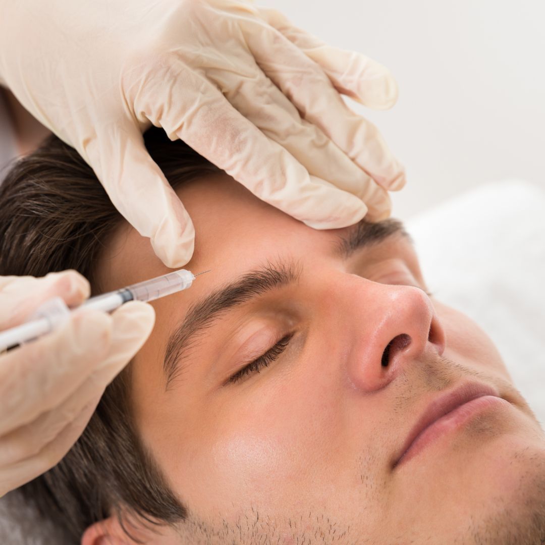 Botox injection procedure on a male patient's forehead.