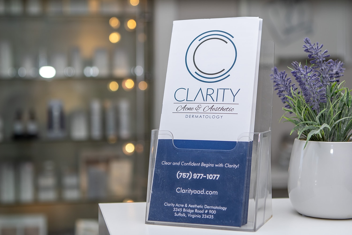 Clarity Acne and Aesthetic Dermatology brochure display.