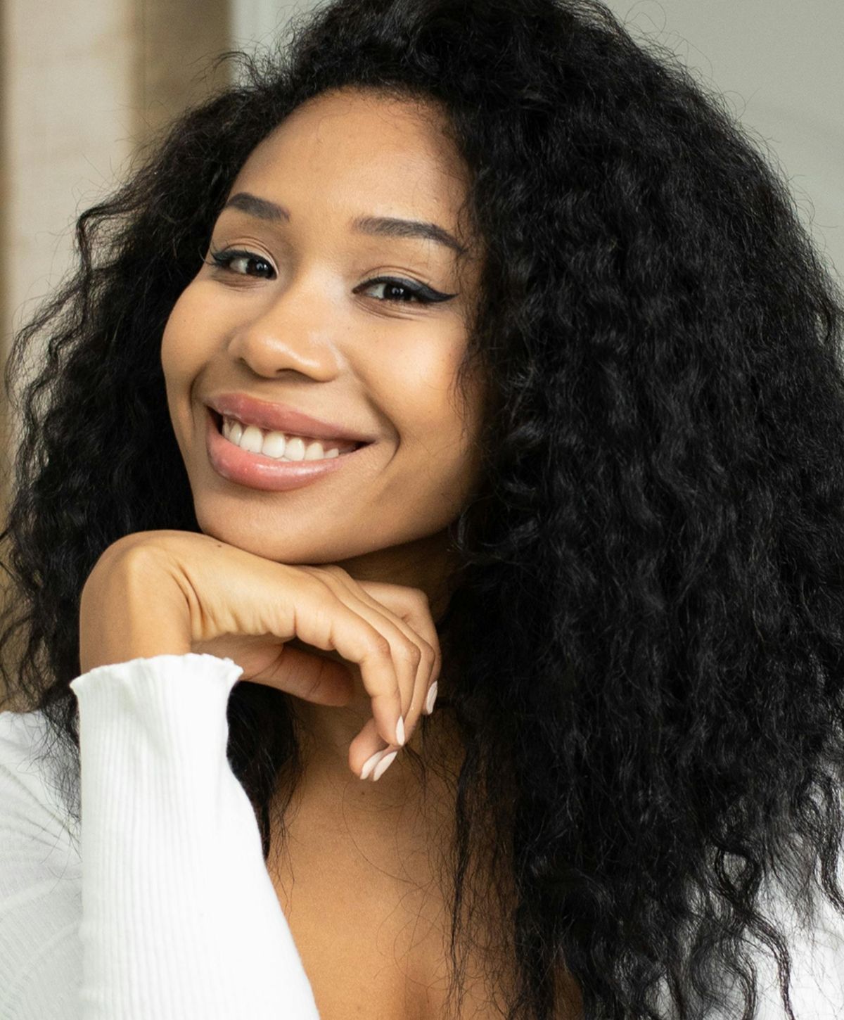 Young woman with light blonde hair and blue eyes.