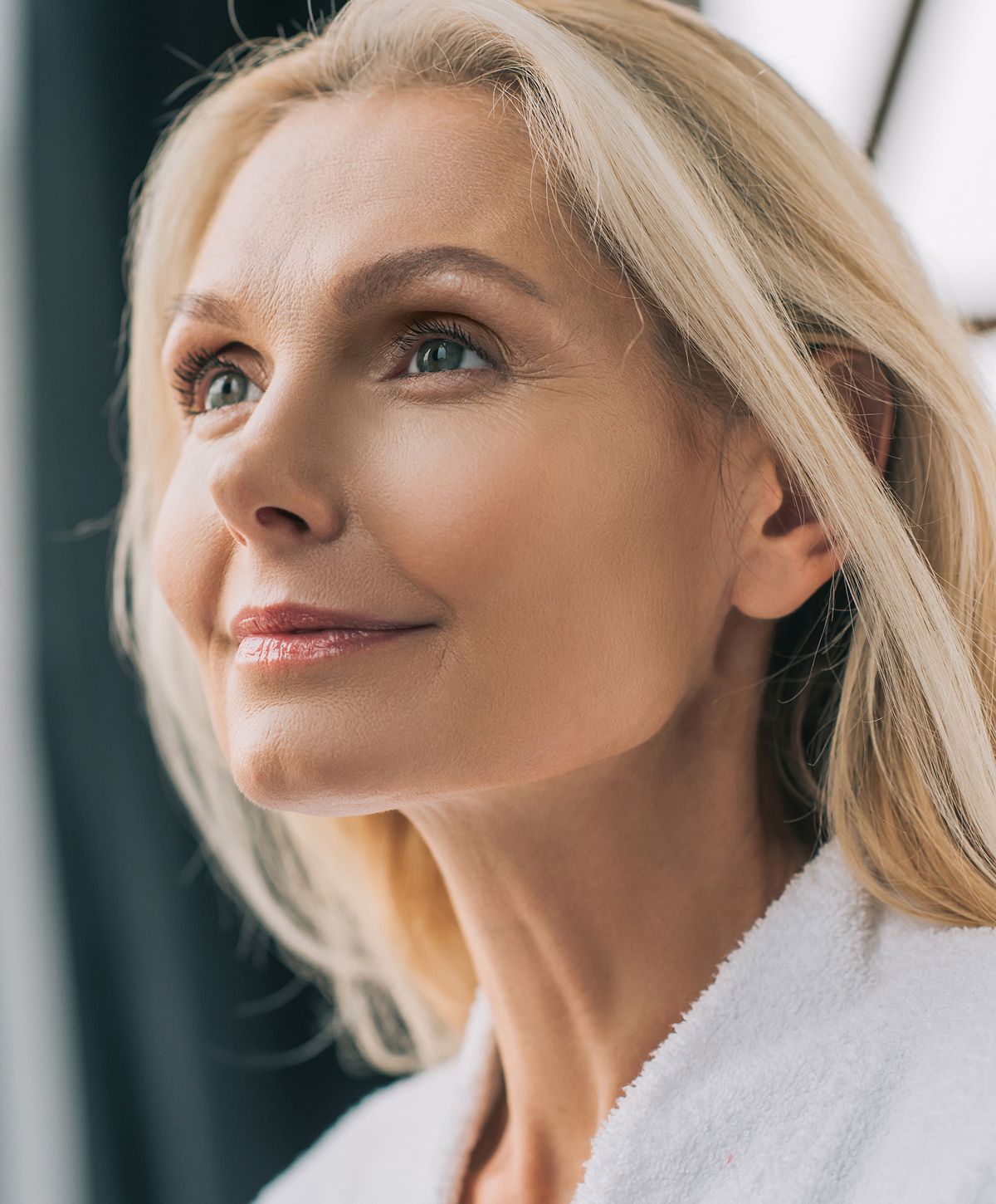 Young woman with light blonde hair and blue eyes.