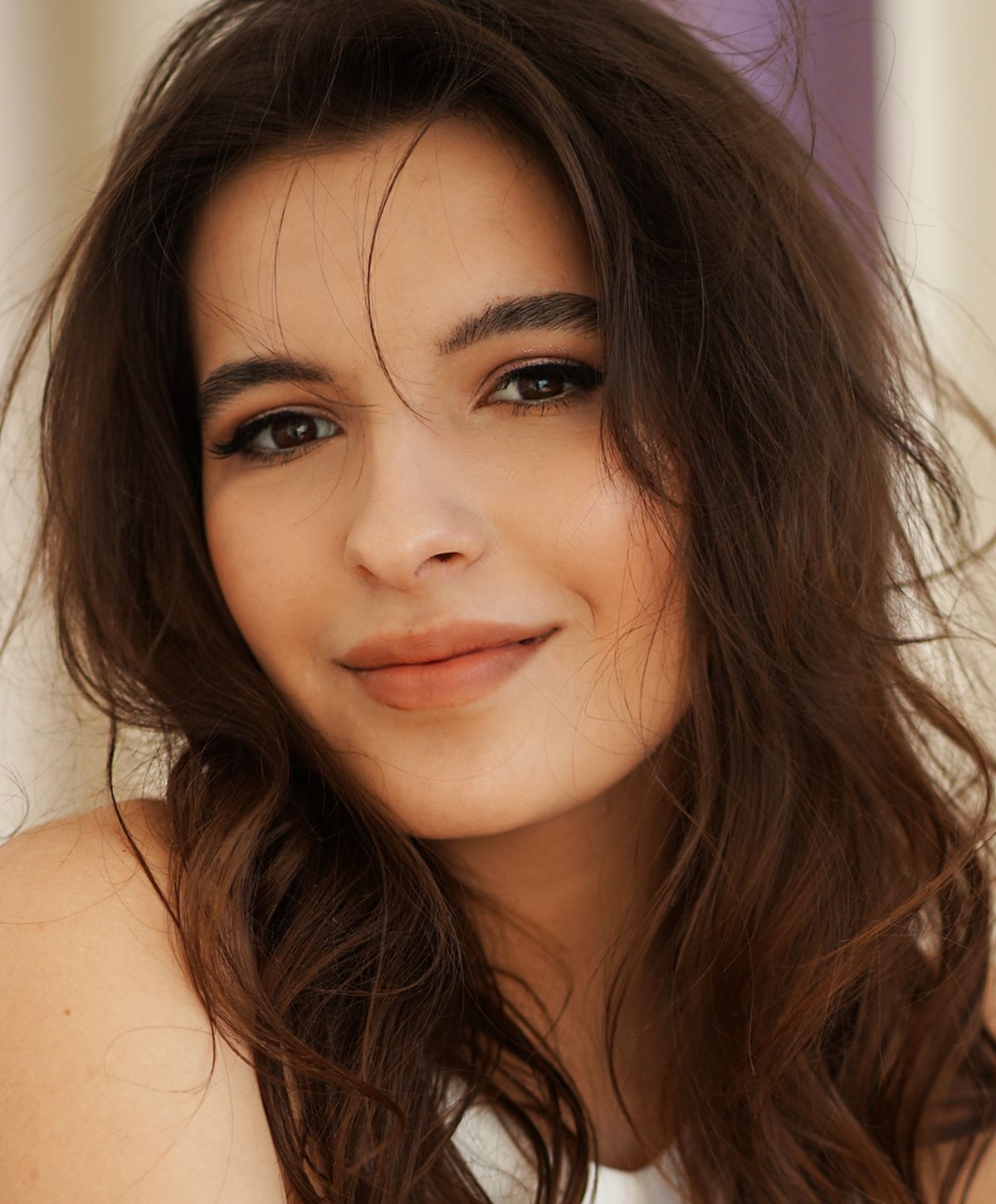 Young woman with light blonde hair and blue eyes.