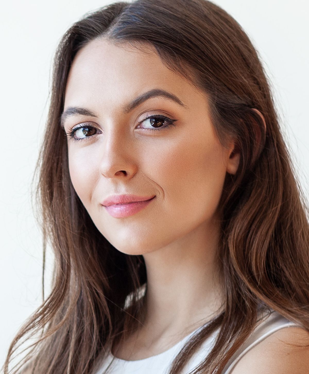 Young woman with light blonde hair and blue eyes.