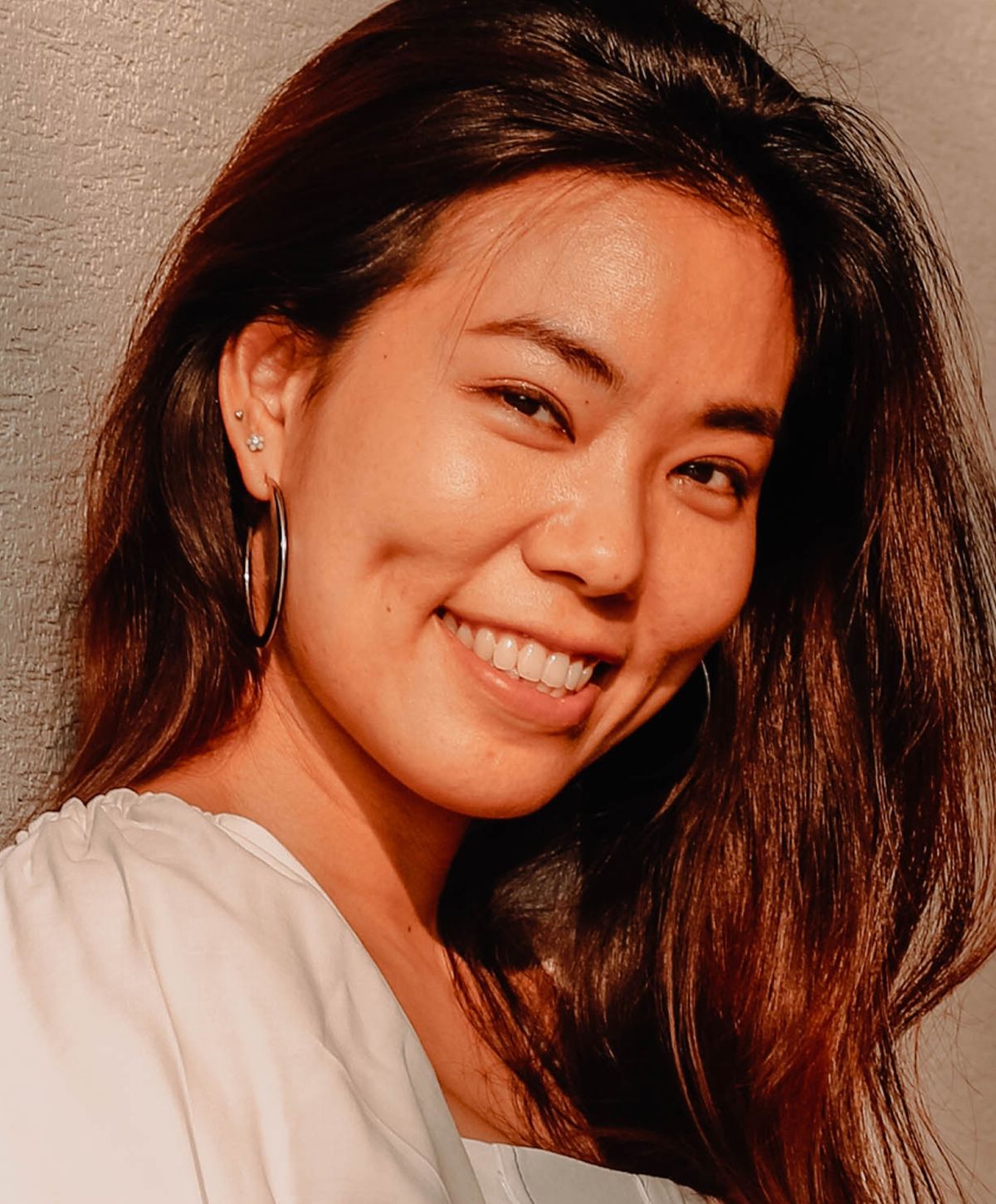 Young woman with light blonde hair and blue eyes.