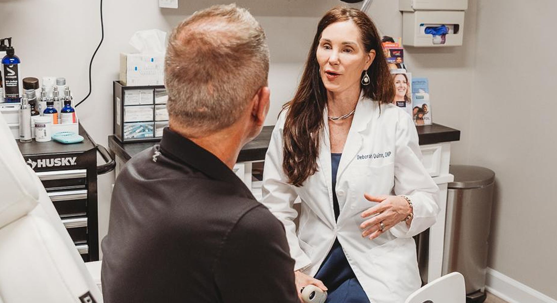 Doctor consulting with patient in medical office.