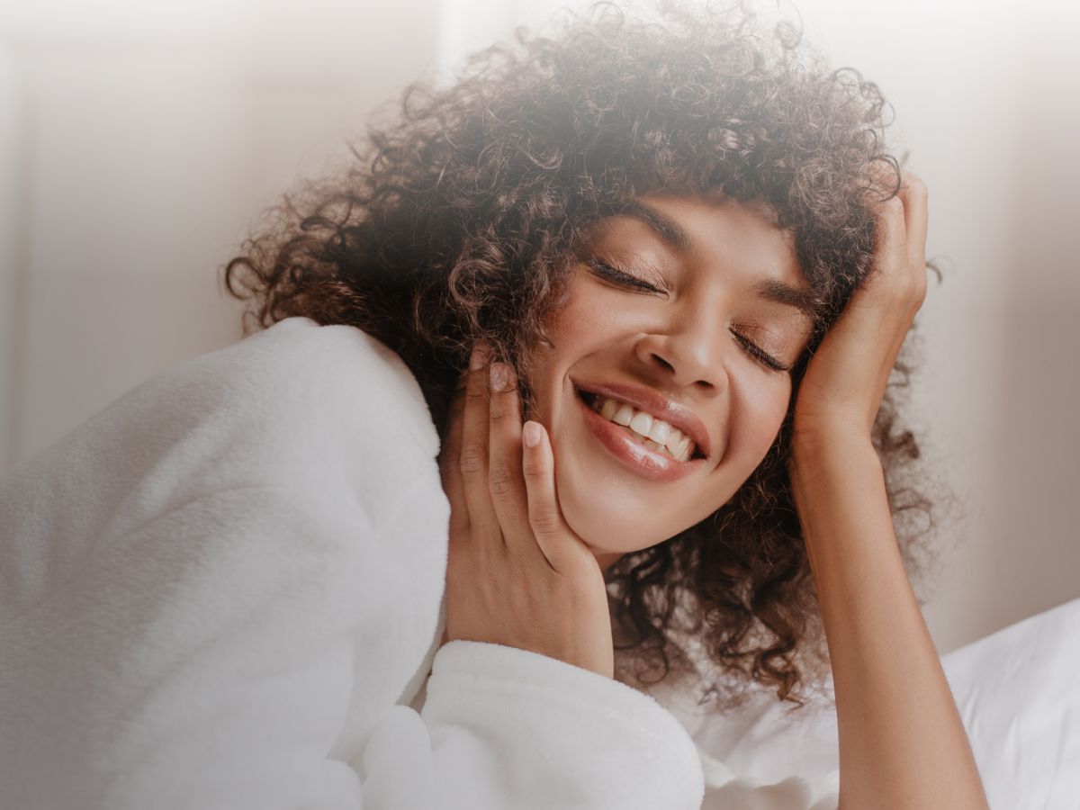 Smiling person enjoying a moment of relaxation.