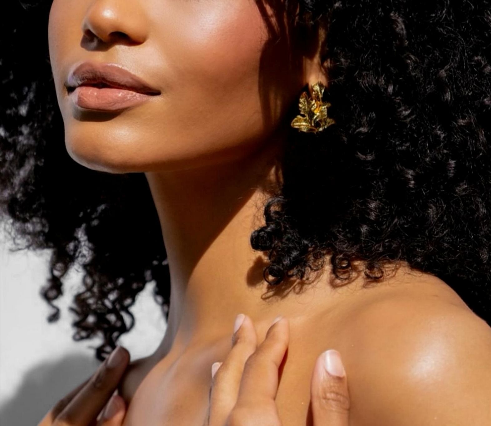 Close-up of a woman with clear, glowing skin, representing regenerative aesthetics and laser skin rejuvenation.