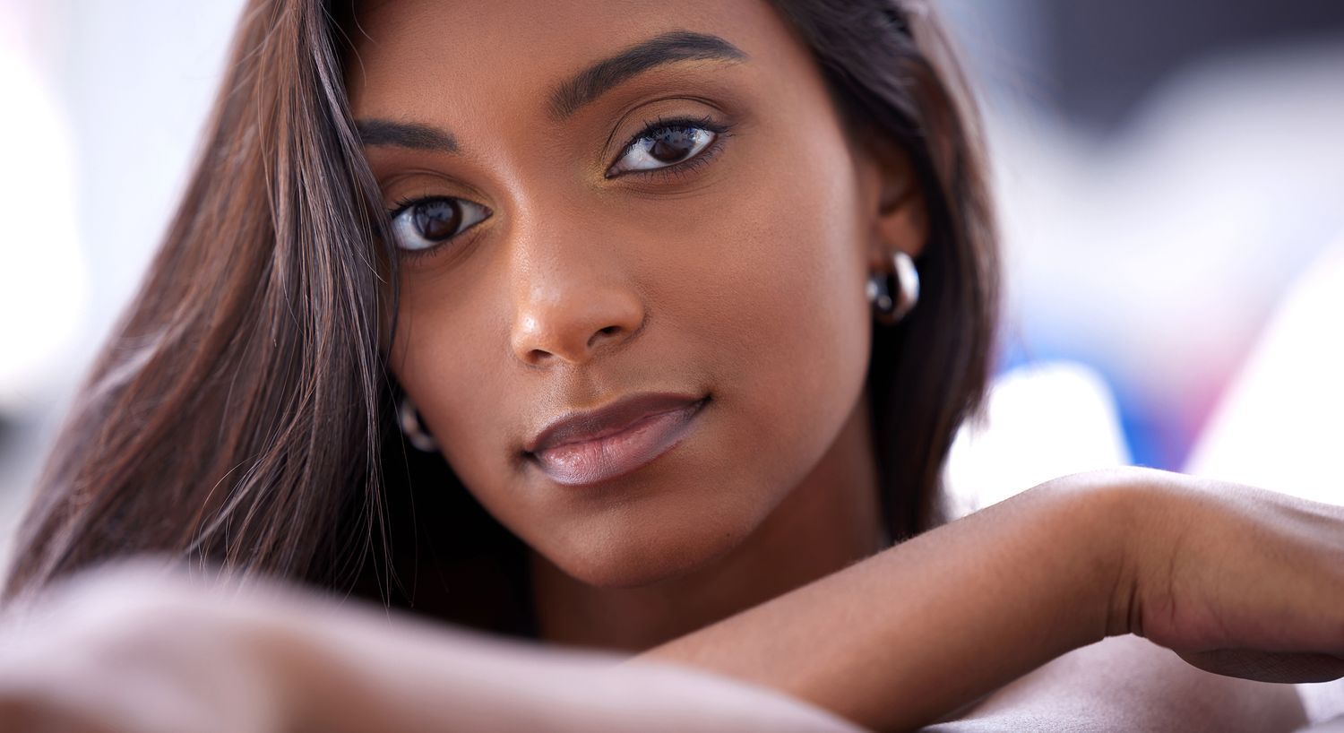 Close-up of a young woman with long hair.